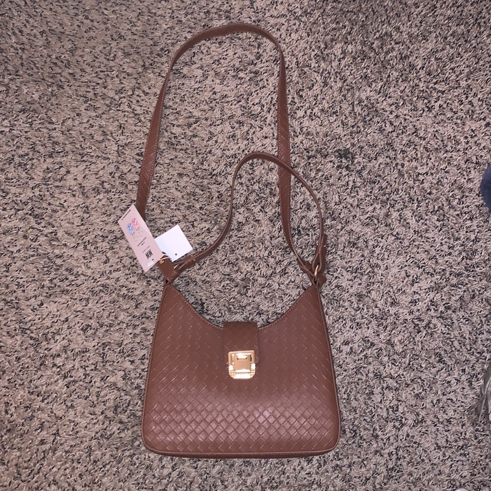 Brown crossbody bag , inside zipper with outside lock